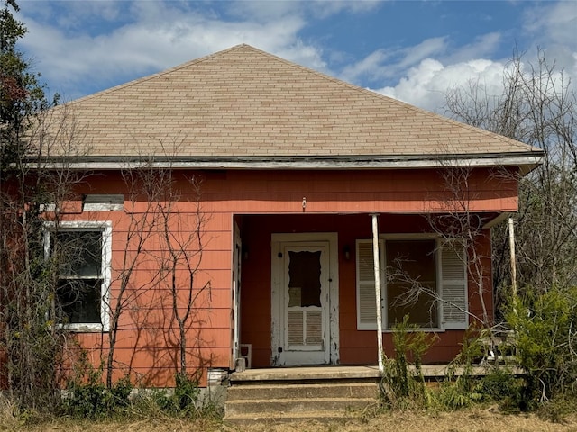198 Anderson Ln, Red Rock, TX 78662 - entrance to property with a shingled roof and covered porch
