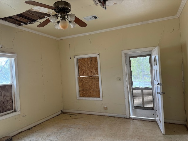 spare room featuring ceiling fan and crown molding