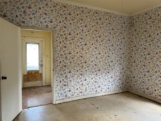 198 Anderson Ln, Red Rock, TX 78662 - empty room with wallpapered walls, ornamental molding, and baseboards