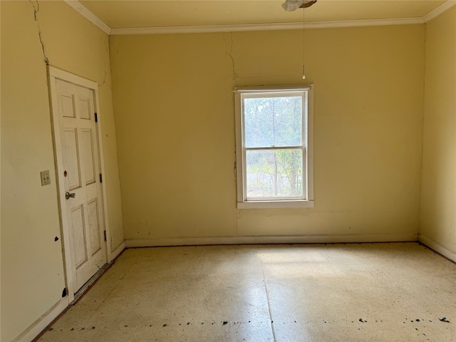 spare room with crown molding