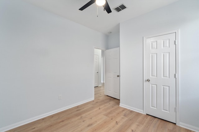 unfurnished bedroom with ceiling fan and light hardwood / wood-style flooring