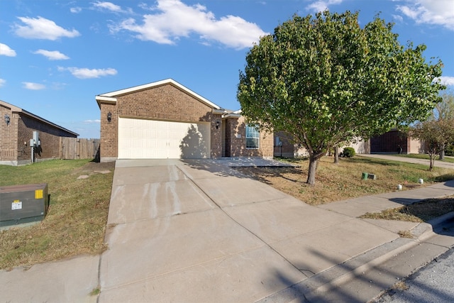 view of front of house featuring a garage and a front yard