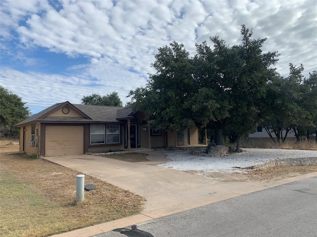 obstructed view of property with a garage