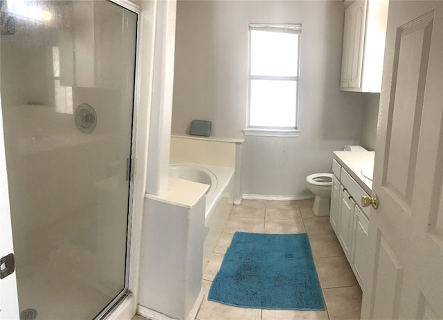 full bathroom with tile patterned flooring, shower with separate bathtub, vanity, and toilet