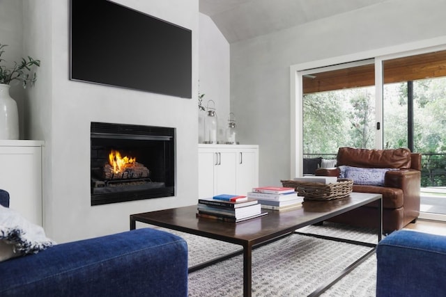 4101 Mcbrine Pl, Austin, TX 78746 - living room with a lit fireplace and lofted ceiling