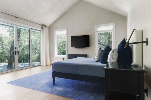 4101 Mcbrine Pl, Austin, TX 78746 - bedroom with access to exterior, wood finished floors, and vaulted ceiling