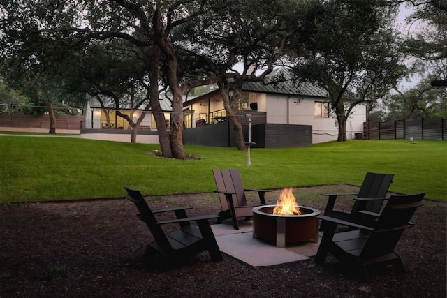 view of yard with an outdoor fire pit