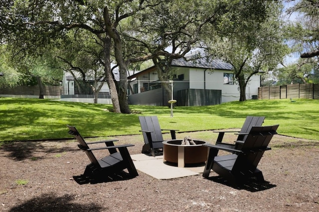 view of yard with an outdoor fire pit