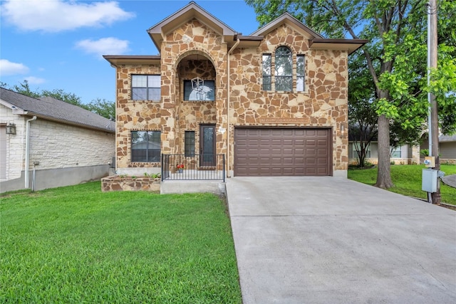 view of front facade featuring a garage and a front lawn