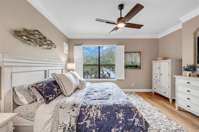 bedroom with ceiling fan, light wood-type flooring, and crown molding