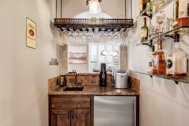 bar with stainless steel refrigerator and sink