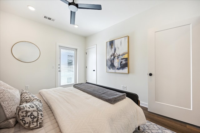 bedroom with ceiling fan and dark hardwood / wood-style flooring