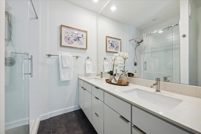 bathroom with tile patterned flooring, vanity, and a shower with shower door