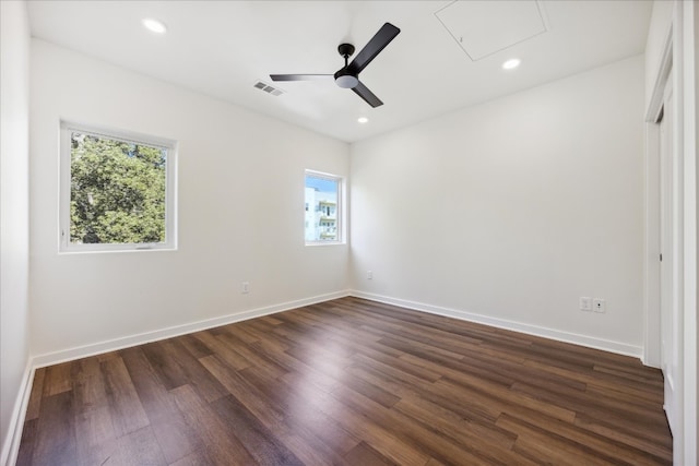 unfurnished room featuring dark hardwood / wood-style floors and ceiling fan