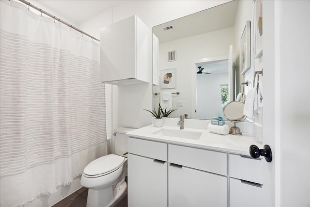 bathroom featuring tile patterned floors, ceiling fan, toilet, and vanity