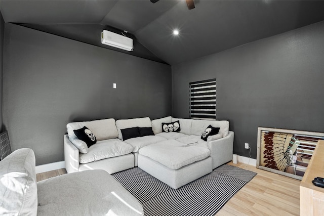 living room with hardwood / wood-style floors, a wall mounted air conditioner, and vaulted ceiling