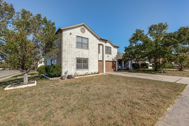 view of front facade with a garage and a front lawn