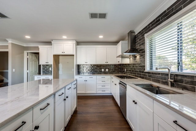 kitchen with light stone countertops, sink, wall chimney range hood, dark hardwood / wood-style flooring, and ornamental molding