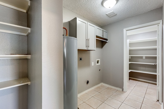 washroom with gas water heater, hookup for a washing machine, light tile patterned floors, a textured ceiling, and hookup for an electric dryer