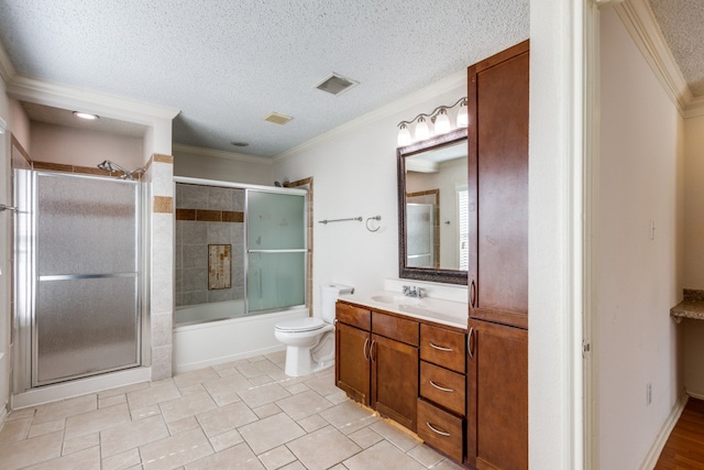 full bathroom featuring a textured ceiling, vanity, toilet, and crown molding