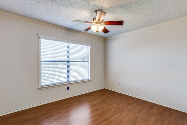 spare room featuring hardwood / wood-style flooring, ceiling fan, ornamental molding, and a textured ceiling