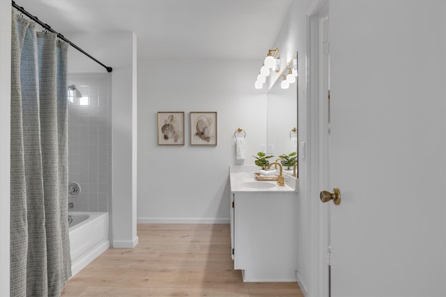 bathroom with vanity, shower / tub combo, and hardwood / wood-style floors