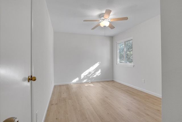 empty room featuring light hardwood / wood-style floors and ceiling fan