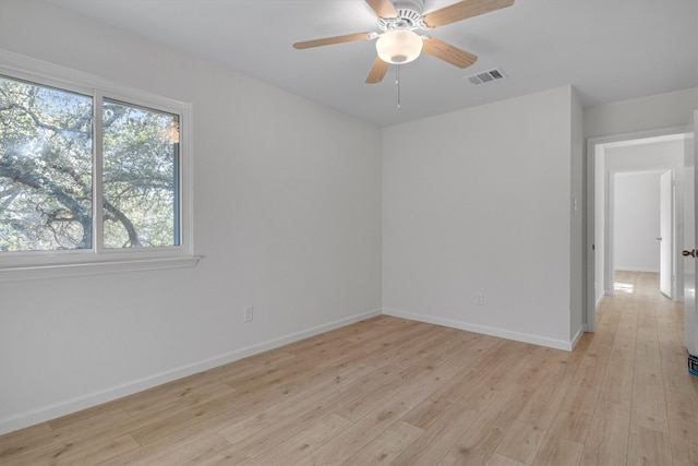 unfurnished room with ceiling fan and light hardwood / wood-style flooring