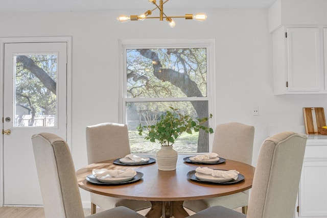 dining area with a notable chandelier