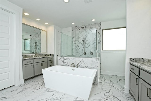 bathroom featuring vanity and plus walk in shower