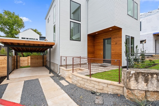 view of patio / terrace featuring a carport