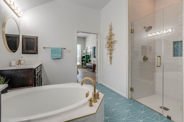 bathroom featuring vanity, separate shower and tub, and tile patterned floors