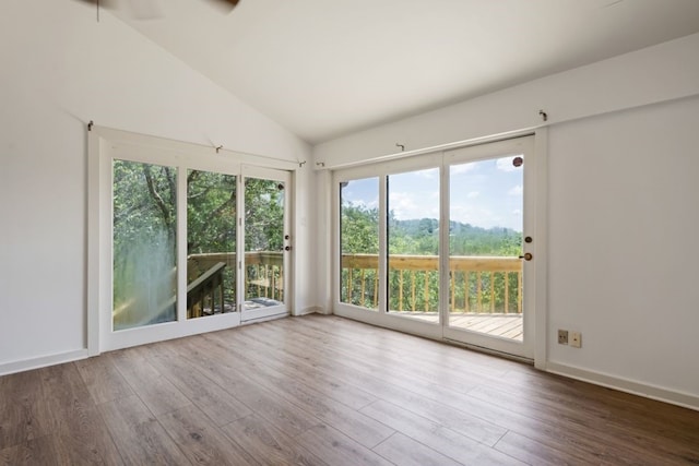 interior space featuring ceiling fan and lofted ceiling