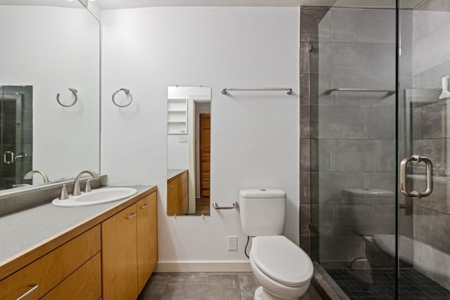 bathroom featuring walk in shower, vanity, and toilet