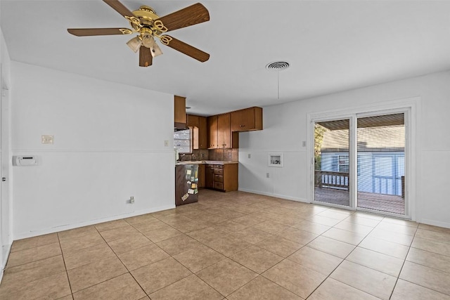 8507 Contour Dr, Austin, TX 78757 - unfurnished living room with light tile patterned flooring, healthy amount of natural light, and ceiling fan