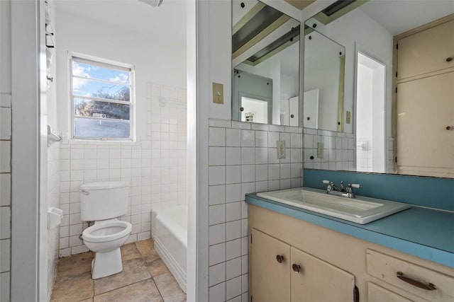 8507 Contour Dr, Austin, TX 78757 - full bath with tile walls, a bath, vanity, and tile patterned floors