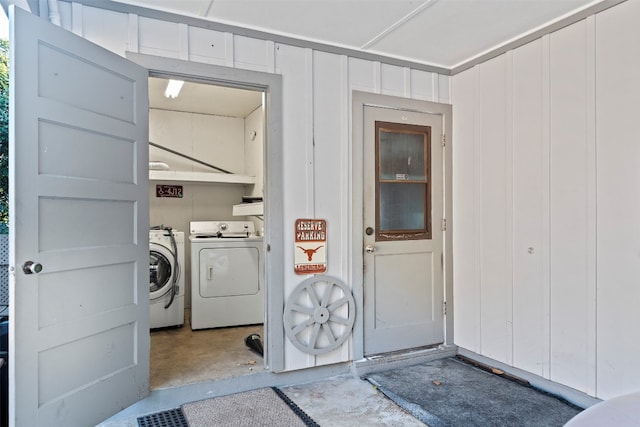 clothes washing area featuring washer and dryer