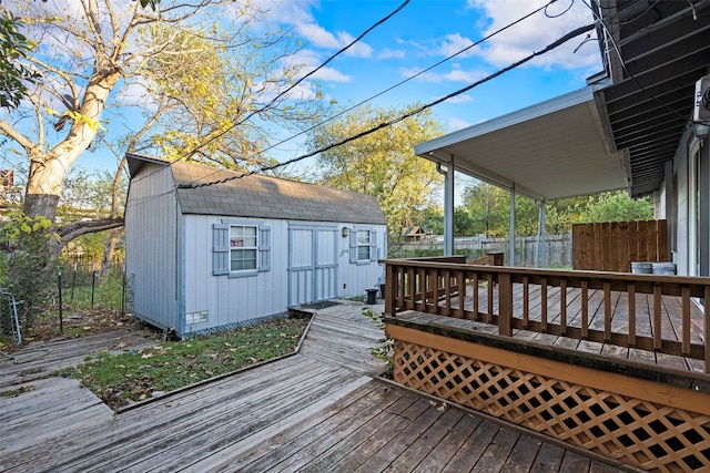 wooden deck with a shed