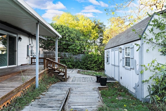 8507 Contour Dr, Austin, TX 78757 - wooden deck with a fenced backyard and an outbuilding