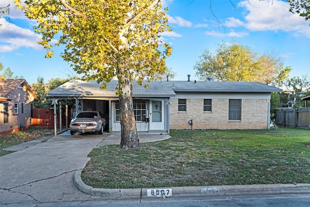 ranch-style house with a front lawn and a carport