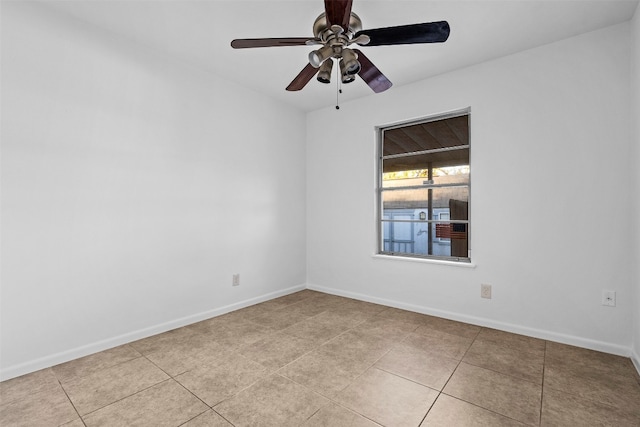 unfurnished room featuring ceiling fan and light tile patterned floors