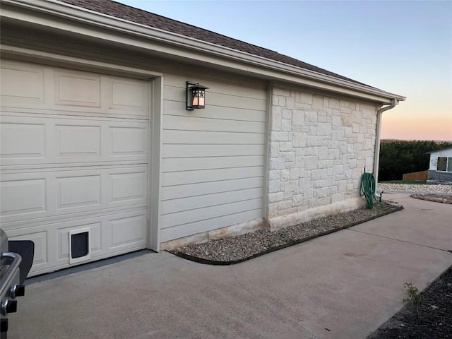 3704 Bunyan Cir, Lago Vista, TX 78645 - view of garage at dusk