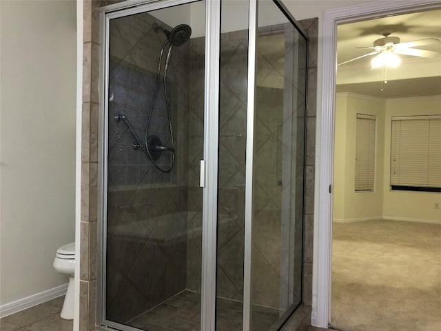 3704 Bunyan Cir, Lago Vista, TX 78645 - bathroom with ceiling fan, a stall shower, and ornamental molding