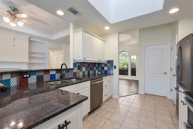 3704 Bunyan Cir, Lago Vista, TX 78645 - kitchen with dishwasher, backsplash, a ceiling fan, white cabinets, and recessed lighting