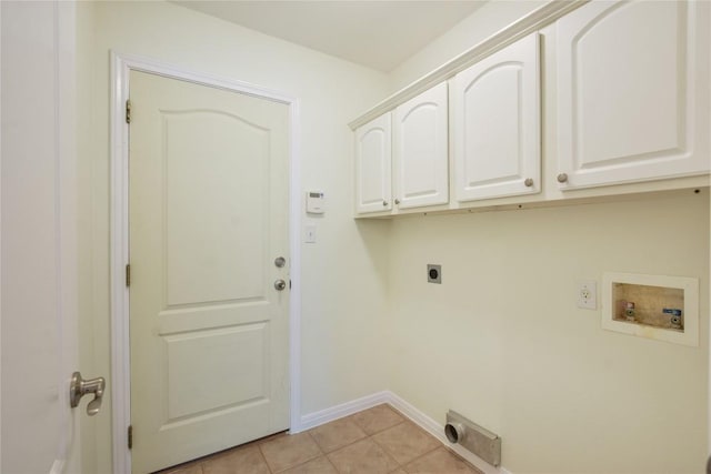 3704 Bunyan Cir, Lago Vista, TX 78645 - laundry area with electric dryer hookup, cabinet space, hookup for a washing machine, and light tile patterned flooring