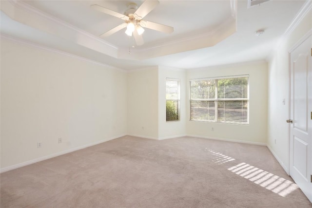 3704 Bunyan Cir, Lago Vista, TX 78645 - empty room with a tray ceiling, ornamental molding, light colored carpet, and ceiling fan