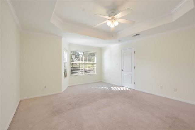 3704 Bunyan Cir, Lago Vista, TX 78645 - empty room featuring a raised ceiling, light colored carpet, crown molding, and ceiling fan