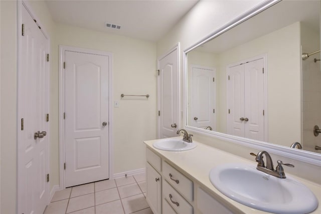 3704 Bunyan Cir, Lago Vista, TX 78645 - full bathroom with double vanity, tile patterned flooring, a shower, and a closet
