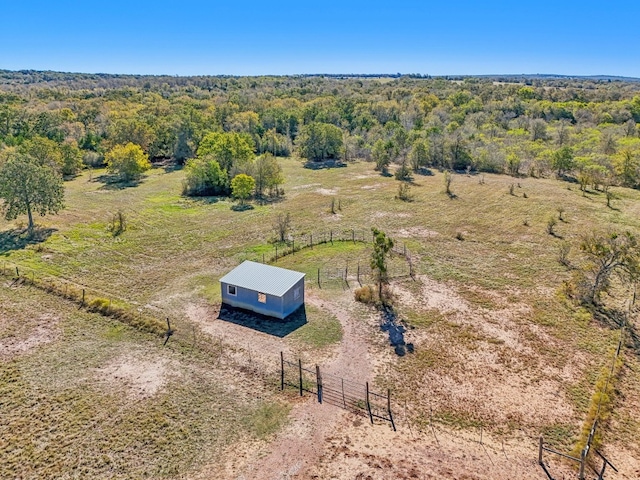 birds eye view of property with a rural view