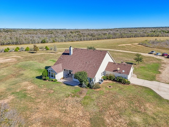 birds eye view of property featuring a rural view